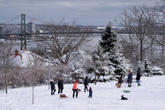 December 25, 2024, Halifax, Ns, Canada: Families play in the snow at Needham Park overlooking Halifax Harbour following a winter storm in Halifax on Christmas Day, Wednesday, Dec. 25, 2024. Halifax Canada  - ZUMAc35_ 20241225_zaf_c35_018 Copyright: xDarrenxCalabresex