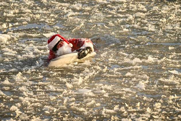 December 25, 2024, Montreal, Pq, Canada: Carlos Hebert Plante, who boogie boards daily, dressed as Santa Claus to hit the water amid an air temperature of -14 degrees Celsius on Christmas Day, in Montreal, Wednesday, Dec. 25, 2024. The standing wave on the St-Lawrence River is close to downtown Montreal and itöÄÃ s a popular spot for surfers. Montreal Canada - ZUMAc35_ 20241225_zaf_c35_021 Copyright: xBernardxBraultx