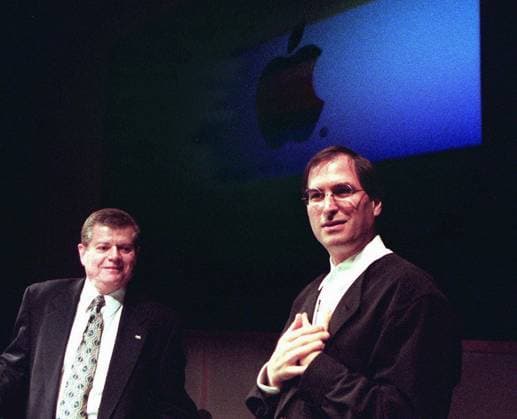 Steve Jobs In this December 20, 1996 file photograph, Steve Jobs, right, at a hastily called news conference with Apple Chairman Gilbert R. Amelio, share the spotlight, both pledging to bring the troubled company into a bright new future. (Michael Rondou San Jose Mercury News MCT) Cupertino CA USA EDITORIAL USE ONLY Copyright: xx 1112285 MichaelxRondoux krtphotoslive513406