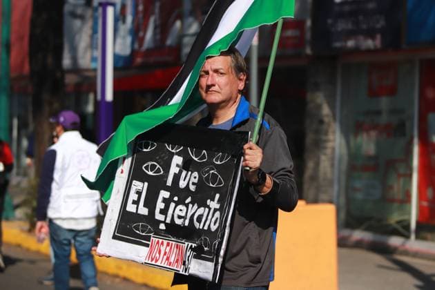 A person taking part during a demonstration for the 43 missing students from Ayotzinapa from the Glorieta de Peralvillo to the Basilica of Guadalupe. on December 26, 2024 in Mexico City, Mexico. Mexico City Mexico - ZUMAe321 20241226_zia_e321_045 Copyright: xCarlosxSantiagox
