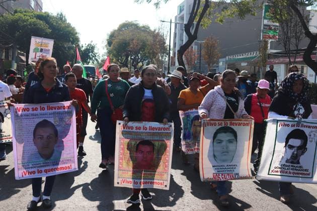 Relatives of the 43 missing students from Ayotzinapa take part during a demonstration from the Glorieta de Peralvillo to the Basilica of Guadalupe. on December 26, 2024 in Mexico City, Mexico. Mexico City Mexico - ZUMAe321 20241226_zia_e321_054 Copyright: xCarlosxSantiagox