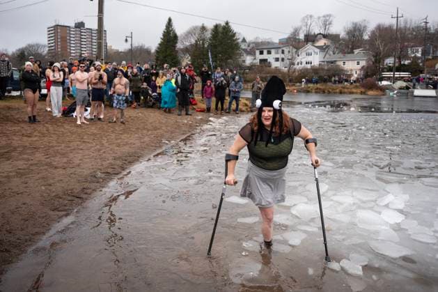 January 1, 2025, Dartmouth, Ns, Canada: Vicki Morton prepares to enter the ice-filled water in Lake Banook during the annual polar bear swim on New Year s Day in Dartmouth, N.S., Wednesday, Jan. 1, 2025. Dartmouth Canada  - ZUMAc35_ 20250101_zaf_c35_021 Copyright: xDarrenxCalabresex