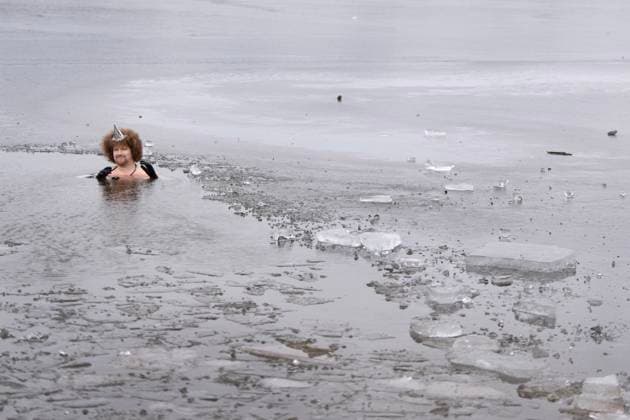 January 1, 2025, Dartmouth, Ns, Canada: Shawn Gillis wears a party hat while swimming in the ice-filled water in Lake Banook during the annual polar bear swim on New Year s Day in Dartmouth, N.S., Wednesday, Jan. 1, 2025. Dartmouth Canada  - ZUMAc35_ 20250101_zaf_c35_023 Copyright: xDarrenxCalabresex