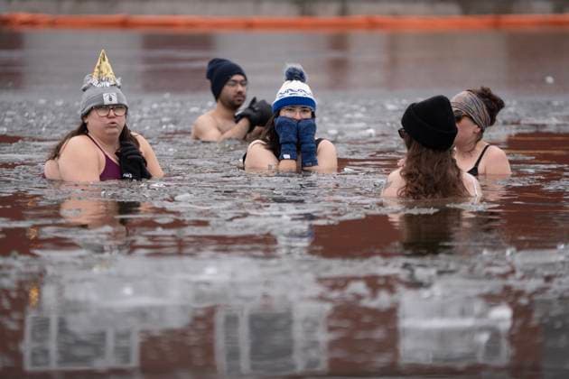 January 1, 2025, Dartmouth, Ns, Canada: People swim in the ice-filled water in Lake Banook during the annual polar bear swim on New Year s Day in Dartmouth, N.S., Wednesday, Jan. 1, 2025. Dartmouth Canada  - ZUMAc35_ 20250101_zaf_c35_026 Copyright: xDarrenxCalabresex
