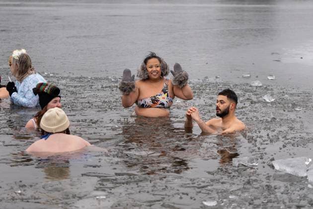 January 1, 2025, Dartmouth, Ns, Canada: People swim in the ice-filled water in Lake Banook during the annual polar bear swim on New Year s Day in Dartmouth, N.S., Wednesday, Jan. 1, 2025. Dartmouth Canada  - ZUMAc35_ 20250101_zaf_c35_029 Copyright: xDarrenxCalabresex