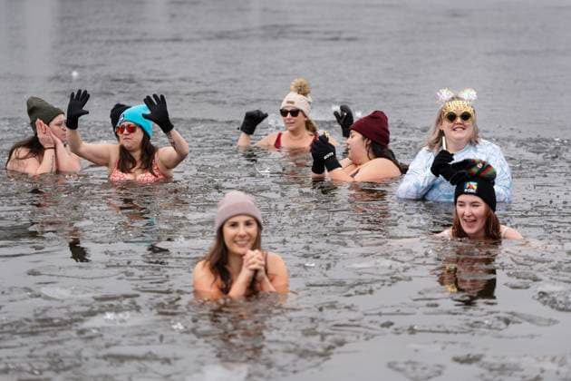 January 1, 2025, Dartmouth, Ns, Canada: People swim in the ice-filled water in Lake Banook during the annual polar bear swim on New Year s Day in Dartmouth, N.S., Wednesday, Jan. 1, 2025. Dartmouth Canada  - ZUMAc35_ 20250101_zaf_c35_028 Copyright: xDarrenxCalabresex