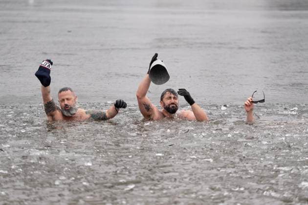 January 1, 2025, Dartmouth, Ns, Canada: People swim in the ice-filled water in Lake Banook during the annual polar bear swim on New Year s Day in Dartmouth, N.S., Wednesday, Jan. 1, 2025. Dartmouth Canada  - ZUMAc35_ 20250101_zaf_c35_030 Copyright: xDarrenxCalabresex