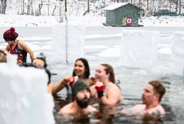 January 1, 2025, Chelsea, Pq, CAN: A Canadian flag flies from the door of a nearby boathouse on Gatineau Park s Meech Lake in Chelsea, Que., during a polar bear dip on New Year s Day, Wednesday, Jan. 1, 2025. Chelsea CAN  - ZUMAc35_ 20250101_zaf_c35_050 Copyright: xJustinxTangx