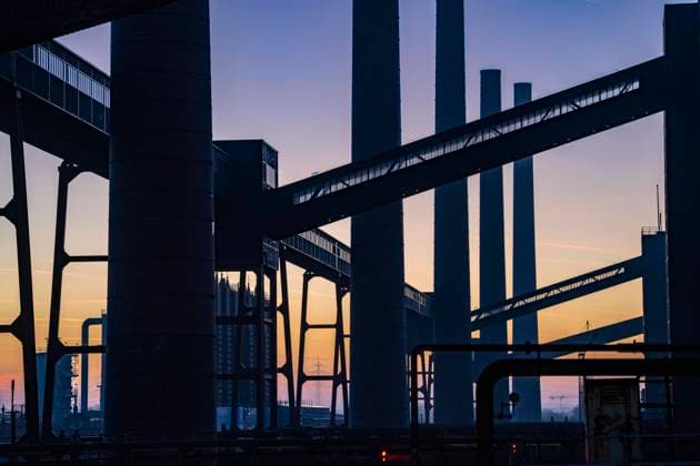 World Heritage Zollverein Coal Mine Industrial Complex, Zollverein Coking Plant, Chimneys and conveyor bridges in the evening light, Essen, Germany, Zollverein Coking Plant