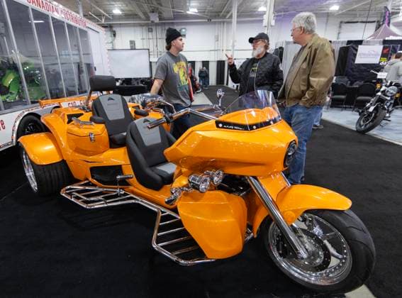 (250103) -- MISSISSAUGA (CANADA), Jan. 3, 2025 -- People look at a three-wheel motorcycle during the 2025 North American International Motorcycle Supershow in Mississauga, Ontario, Canada, on Jan. 3, 2025. Featuring hundreds of motorcycles, the annual three-day event kicked off here on Friday. (Photo by Xinhua) CANADA-MISSISSAUGA-NORTH AMERICAN INTERNATIONAL MOTORCYCLE SUPERSHOW ZouxZheng 