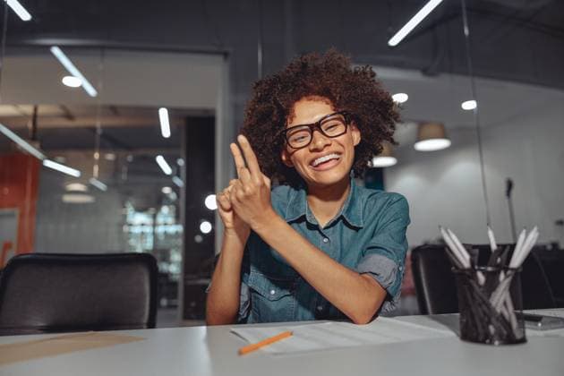 Smiling African American lady talking with sign language while sitting at her workplace in the office, model released, , property released, , 45147484.jpg, cheerful, office, employer, work, career, woman, corporate, manager, assistance, positive, executive, workplace, coworking, businesswoman, worker, technology, professional, room, interior, modern, desk, African American, document, smile, business, agent, lifestyle, happy, job, sit, glasses, young, employment, person, ASL, female, online, internet, deaf, sign language RECORD DATE NOT STATED