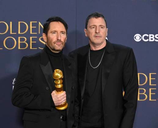(L-R) Trent Reznor and Atticus Ross, winners of the Best Original Score - Motion Picture award for Challengers, appear backstage during the 82nd annual Golden Globe Awards at the Beverly Hilton Hotel in Beverly Hills, California on Sunday, January 5, 2025.  LAP20250105476 JIMxRUYMEN