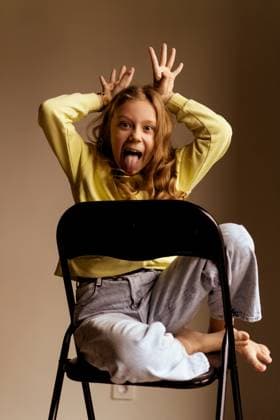 Creative Highlights Symbolbilder Portrait of playful girl sticking out tongue while Minsk, Minsk Region, Belarus CR_YUKI250102C-1600386-01 ,model released, Symbolfoto