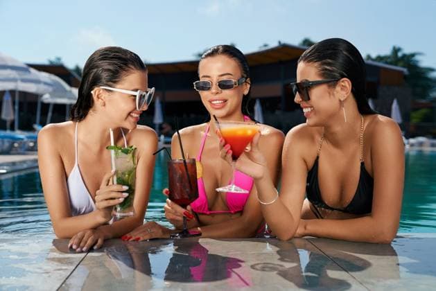 Front view of three pretty girls standing in swimming pool. Seductive young females wearing swimsuits, holding cocktails, relaxing, looking at each other. Concept of summer., model released, , 46407708.jpg, water, swimming, standing, sunbathing, relaxing, enjoying, swimsuit, bikini, swimwear, looking, each other, smiling, pool, holding, cocktail, talking, leisure, travel, recreation, activity, vacation, happiness, joy, fun, colorful, happy, lifestyle, young, beautiful, seductive, attractive, long, hair, wet, sunglasses, slim, brunette, three, girls, women, female, people, adult, caucasian, summer, sunny, outdoor, nature RECORD DATE NOT STATED
