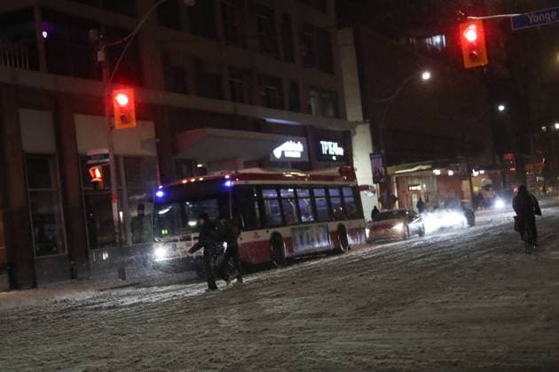 Overnight Snowfall In Ontario People Cross An Intersection At Bloor And Yonge As Toronto And The GTA Areas Experience Overnight Snowfall In Ontario, Canada, On January 11, 2025. Toronto Canada  Copyright: xArrushxChoprax originalFilename: chopra-notitle250111_npY89.jpg