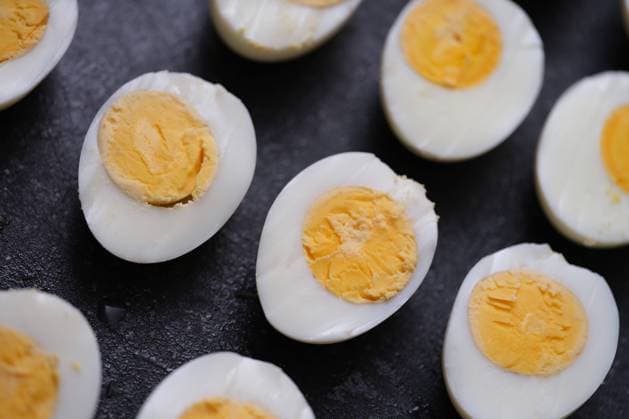 Sliced hard boiled eggs on dark background. Healthy food concept , 47816678.jpg, sliced, hard, boiled, white, healthy, food, natural, protein, diet, calcium, vitamin, benefit, yellow, breakfast, cardiac, weight, cardiology, chicken, cholesterol, closeup, concept, cook, cooked, cuisine, delicious, disease, eat, egg, foodstuff, fresh, calories, gastronomy, healthcare, gourmet, halves, heart, cut, ingredient, meal, nutrient, easter, farm, nutrition, organic, oval, prepared, slice, loss, snack, yolk RECORD DATE NOT STATED