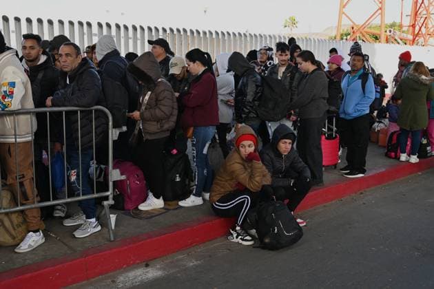 January 20, 2025, Tijuana, Baja California, Mexico: Asylum seekers wait for their CBP One appointments before crossing through El Chaparral border port in Tijuana, Mexico on January 20, 2025. The Trump administration shut down the CBP One app for migrants. The Biden-era process allowed nearly 1 million migrants to enter the US at legal border crossings since the app initiated. It is estimated that 270,000 migrants are waiting in Mexico, hoping to use the app to enter the US. Tijuana Mexico - ZUMAm180 20250120_zip_m180_013 Copyright: xCarlosxA.xMorenox