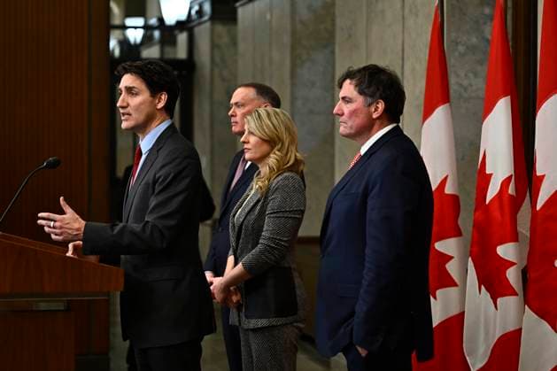 February 1, 2025, Ottawa, On, CANADA: Prime Minister Justin Trudeau addresses media following the imposition of a raft of tariffs by U.S. President Donald Trump against Canada, Mexico and China, in Ottawa, Saturday, Feb. 1, 2025. Minister of Public Safety David McGuinty, left to right, Global Affairs Minister Melanie Joly and Minister of Governmental Affairs Dominic LeBlanc look on. Ottawa CANADA - ZUMAc35_ 20250201_zaf_c35_126 Copyright: xJustinxTangx