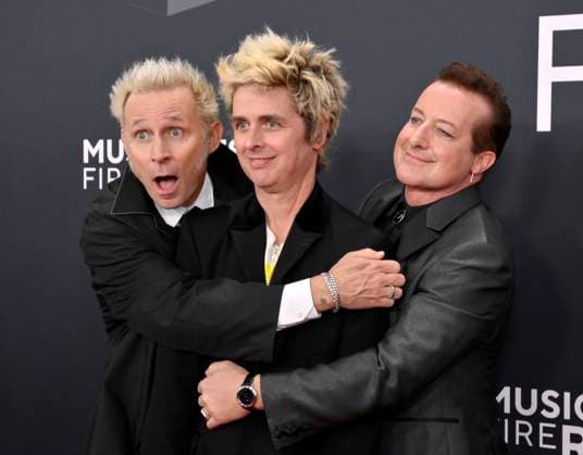 (L-R) Mike Dirnt, Billie Joe Armstrong, and Tré Cool of Green Day arrive for the 67th Annual Grammy Awards at Crypto.com Arena in Los Angeles on February 2, 2025. The awards ceremony will honor the best recordings, compositions, and artists from September 16, 2023, to August 30. 2024, as chosen by the members of the Recording Academy.  LAP20250202304 JIMxRUYMEN