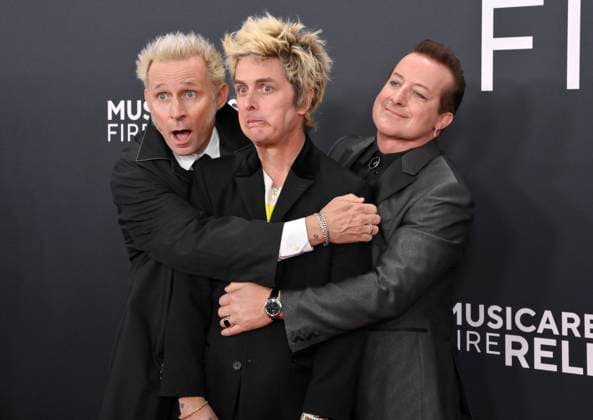 (L-R) Mike Dirnt, Billie Joe Armstrong, and Tré Cool of Green Day arrive for the 67th Annual Grammy Awards at Crypto.com Arena in Los Angeles on February 2, 2025. The awards ceremony will honor the best recordings, compositions, and artists from September 16, 2023, to August 30. 2024, as chosen by the members of the Recording Academy.  LAP20250202305 JIMxRUYMEN