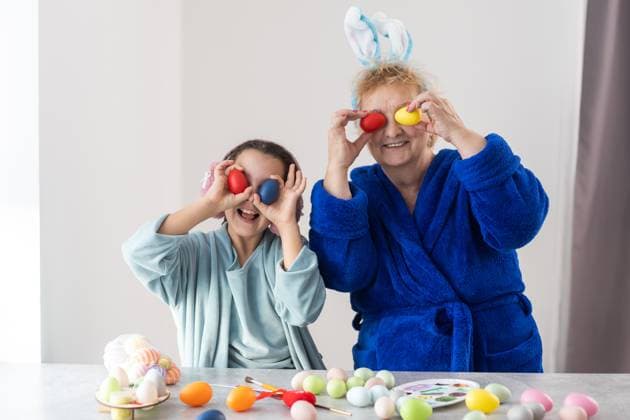 Little girl with grandmother dyeing Easter eggs., model released, , 49289326.jpg, preparation, family, egg, grandmother, easter, season, decoration, girl, togetherness, tradition, home, generation, senior, table, childhood, granddaughter, cute, costume, art and craft, decorative, child, celebration, celebrate, colorful, event, happiness, fun, funny, granny, bunny, vibrant color, paint, festive, spring, traditional, dye, costume rabbit ears, domestic life, coloring, creativity, kid, rabbit, holiday, drinking glass, basket, seasonal, little, together, beautiful, indoor RECORD DATE NOT STATED