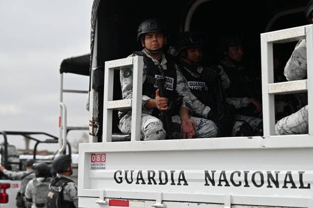 February 4, 2025, Tijuana, Baja California, Mexico: Members of the Mexican National Guard arrive at Military Air Base No. 12 near the Tijuana International Airport in Tijuana, Baja California, Mexico, on Tuesday, February 04, 2025. The arrival of Mexicoâ€⠢s first 300 officers in the border city begins the 10,000 troop deployment President Claudia Sheinbaum had promised US President Donald Trump in exchange for delaying a 25-percent tariff on exported goods for a month with future negotiations to be determined. Tijuana Mexico - ZUMAm180 20250204_zip_m180_004 Copyright: xCarlosxA.xMorenox