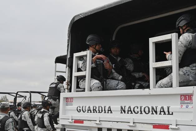 February 4, 2025, Tijuana, Baja California, Mexico: Members of the Mexican National Guard arrive at Military Air Base No. 12 near the Tijuana International Airport in Tijuana, Baja California, Mexico, on Tuesday, February 04, 2025. The arrival of Mexicoâ€⠢s first 300 officers in the border city begins the 10,000 troop deployment President Claudia Sheinbaum had promised US President Donald Trump in exchange for delaying a 25-percent tariff on exported goods for a month with future negotiations to be determined. Tijuana Mexico - ZUMAm180 20250204_zip_m180_008 Copyright: xCarlosxA.xMorenox