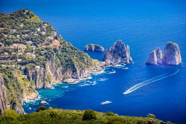 Idyllic aerial view of Capri island city and Faraglioni cliffs and marina with boats and yacht, amalfi coast, Italy , 49579182.jpg, Sorrento, Italy, Beach, Coastline, Peninsula, Europe, Naples, Positano, Amalfi, Town, Bay of Water, Cityscape, Cliff, Gulf Of Naples, Harbor, Horizontal, Nature, No People, Outdoors, Photography, Scenics, Sea, Seascape, Southern Italy, Summer, Tourism, Tourist Resort, Travel Destinations, UNESCO, Vacations, Village, Volcanic Landscape, Water, yacht, sailboat, Beauty, Blue, Campania, sunny, Sky, Landscape, Mediterranean Culture, Nautical Vessel, Ship, capri, island, aerial, above, faraglioni RECORD DATE NOT STATED