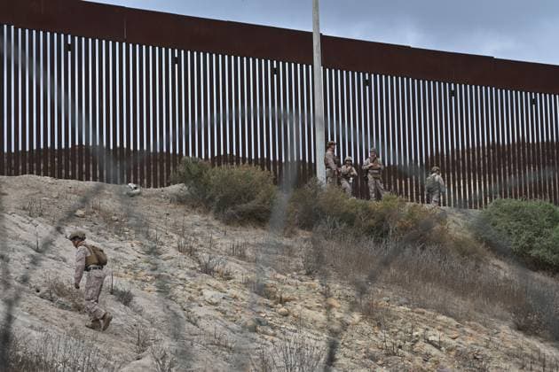 February 6, 2025, Tijuana, Baja California, Mexico: Members of the US Marine Corps patrolling along the US-Mexico border wall in San Diego, California, seen from Tijuana, Mexico in between the San Diego-Tijuana border fences of Colonia Libertad on Thursday, February 06, 2025. The Defense Department deployed 1,600 active-duty troops to the border during US President Donald Trumpâ€⠢s first week in office. Tijuana Mexico - ZUMAm180 20250206_zip_m180_011 Copyright: xCarlosxA.xMorenox
