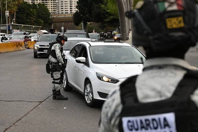 February 6, 2025, Tijuana, Baja California, Mexico: Mexican National Guard officers check vehicles heading to the United States into San Diego, California at the San Ysidro Port of Entry crossing in Tijuana, Baja California, Mexico, on Thursday, February 6, 2025. At the southern border between the US and Mexico a planned distribution of 10,000 Mexican National Guard troops on the US border, under an agreement with US President Donald Trump to stop the flow of migration and drugs like fentanyl. Tijuana Mexico - ZUMAm180 20250206_zip_m180_024 Copyright: xCarlosxA.xMorenox