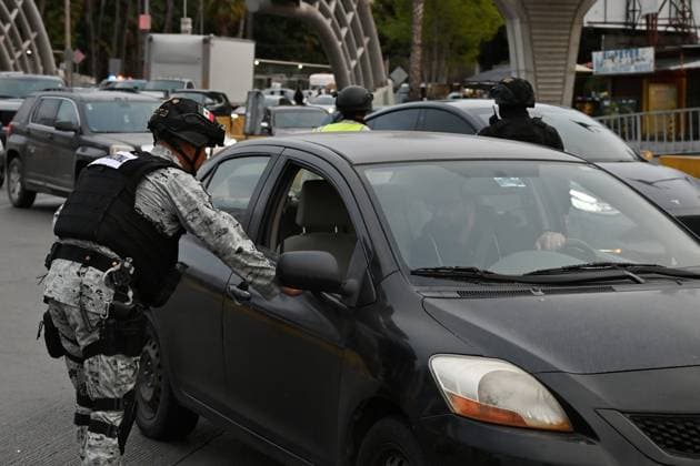 February 6, 2025, Tijuana, Baja California, Mexico: Mexican National Guard officers check vehicles heading to the United States into San Diego, California at the San Ysidro Port of Entry crossing in Tijuana, Baja California, Mexico, on Thursday, February 6, 2025. At the southern border between the US and Mexico a planned distribution of 10,000 Mexican National Guard troops on the US border, under an agreement with US President Donald Trump to stop the flow of migration and drugs like fentanyl. Tijuana Mexico - ZUMAm180 20250206_zip_m180_033 Copyright: xCarlosxA.xMorenox