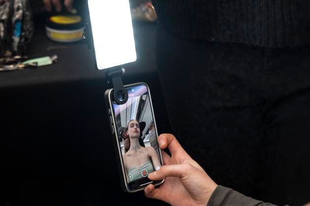February 7, 2025, New York, New York, USA: Model prepares backstage as she records herself for Christian Cowan show at New York Fashion Week Fall Winter 2025 at Glasshouse in New York on February 7, 2025. New collection by designer Cowan was inspired and is tribute to Abbie McLaughlin who passed away in 2024. New York USA - ZUMAr339 20250207_znp_r339_191 Copyright: xLevxRadinx
