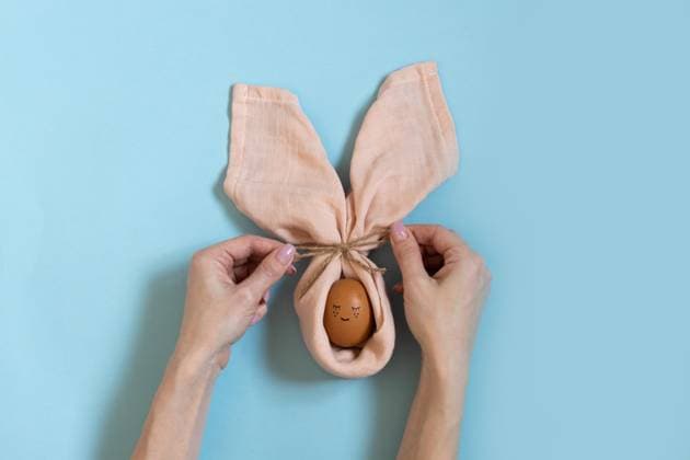 Happy easter table decoration. Easter painted egg bunny. Cute and funny rabbit. Handmade easter table setting with hands. Scandinavian style. Craft, diy , 49985078.jpg, egg, easter, funny, bunny, handmade, abstract, art, background, bagging, brown, burlap, celebrate, celebration, colorful, composition, concept, copyspace, covered, creative, cute, decor, decoration, decorative, ears, fun, hands, happy, heap, holiday, home, idea, image, minimal, nobody, orange, pastel, present, pretty, rabbit, sackcloth, seasonal, spring, symbol, table, table setting, tablecloth, tender, top view, traditional, trendy RECORD DATE NOT STATED