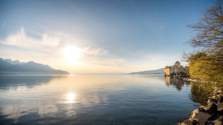 Sunrise at Lake Leman with Chillon Castle near Montreux, Switzerland, showcasing serene water reflections and a clear sky. Model Released NicoescobarPhoto_ID26370_760505_006 Copyright: xNicoescobarxPhotox RECORD DATE NOT STATED