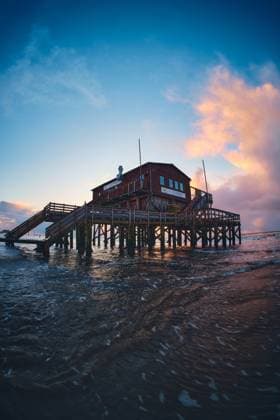 Stelzenhaus in Sankt Peter-Ording bei Sonnenuntergang Stilt House in Sankt Peter-Ording during sunset. High quality photo Copyright: xZoonar.com FlorianxKundex 22719383