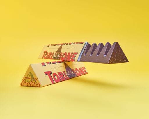 RECORD DATE NOT STATED A yellow background with a Toblerone chocolate bar visible, its iconic triangle shape 20673161