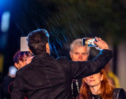 February 13, 2025, Santa Barbara, California, USA: Adrien Brody shoots his selfie in the rain with his phone of him in front of the historic Arlington marquee as he arrives at the red carpet Thursday night to receive the Cinema Vanguard Award at the 40th annual Santa Barbara International Film Festival. Spotlighting their performances in Brady CorbetÃ¢â‚¬â ¢s THE BRUTALIST, BrodyÃ¢â‚¬â ¢s portrayal of Toth highlights an immigrantÃ¢â‚¬â ¢s struggle to overcome his war-torn past and rebuild his life in a Post-War America. Santa Barbara USA - ZUMAa35_ 20250213_zaf_a35_001 Copyright: xDanielxA.xAndersonx