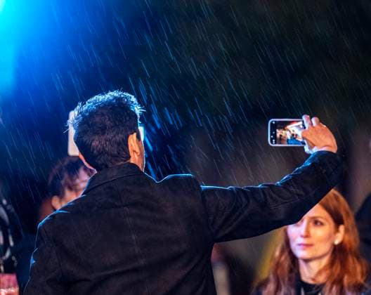 February 13, 2025, Santa Barbara, California, USA: Adrien Brody shoots his selfie in the rain with his phone of him in front of the historic Arlington marquee(see cell phone screen) as he arrives at the red carpet Thursday night to receive the Cinema Vanguard Award at the 40th annual Santa Barbara International Film Festival. Spotlighting their performances in Brady CorbetÃ¢â‚¬â ¢s THE BRUTALIST, BrodyÃ¢â‚¬â ¢s portrayal of Toth highlights an immigrantÃ¢â‚¬â ¢s struggle to overcome his war-torn past and rebuild his life in a Post-War America. Santa Barbara USA - ZUMAa35_ 20250213_zaf_a35_002 Copyright: xDanielxA.xAndersonx