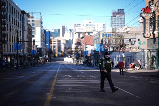 February 14, 2025, Vancouver, Bc, CANADA: A police officer walks on East Hastings Street, that was closed for the annual Women s Memorial March, in Vancouver, on Friday, February 14, 2025. The march is held to honour missing and murdered Indigenous women and girls from the community with stops along the way to commemorate where women were last seen or found. Vancouver CANADA  - ZUMAc35_ 20250214_zaf_c35_122 Copyright: xDarrylxDyckx