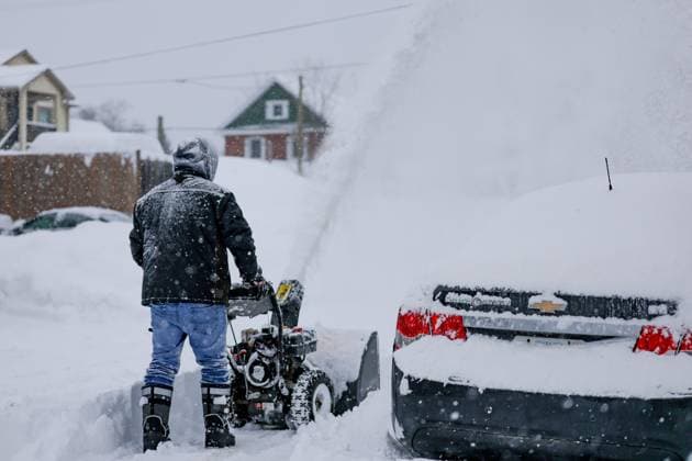 February 16, 2025, Innisfil, Ont, CANADA: INNISFIL, CANADA - BRIAN ROSS uses his snowblower to clear a neighbourÃ¢â‚¬â ¢s property. The Ã¢â‚¬oeFebruary 2025 North American Storm ComplexÃ¢â‚¬Â dubbed Ã¢â‚¬oeEnzoÃ¢â‚¬Â by the Weather Channel blanketed the region with more than 70 cm (over 2 feet) of heavy snow in less than 24 hours. Innisfil is a community approximately 45 minutes north of Toronto. Innisfil CANADA - ZUMAs109 20250216_zaf_s109_003 Copyright: xChristopherxDrostx