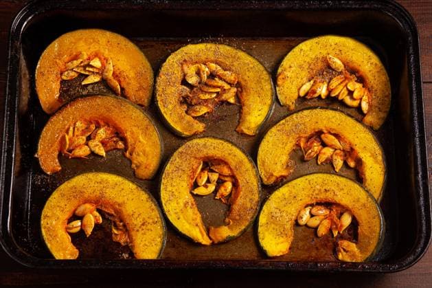 Oven-baked pumpkins on a baking sheet top vew. The concept of proper healthy nutrition Oven-baked pumpkins on a baking sheet top vew. The concept of proper healthy nutrition Copyright: xZoonar.com ElenaxDmitrievax 22859785