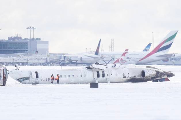 February 18, 2025, Toronto, On, CAN: A Delta Air Lines plane lies upside down at Toronto Pearson Airport on Tuesday, Feb. 18, 2025. Flight 4819 öÄÃ¬ a Bombardier CRJ-900 jet operated by the Delta subsidiary Endeavor Air, crashed while landing in Toronto having flown from Minneapolis on Monday. Toronto CAN  - ZUMAc35_ 20250218_zaf_c35_008 Copyright: xChrisxYoungx