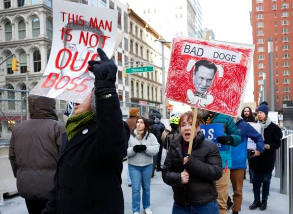 Federal workers and protesters hold signs and form a picket line at a rally in protest against Elon Musk s takeover of public services jobs at 26 Federal Plaza on Wednesday, February 19, 2025 in New York City. The Department of Government Efficiency (DOGE) has ordered mass firings of federal workers around the United States.  NYP20250219113 JohnxAngelillo