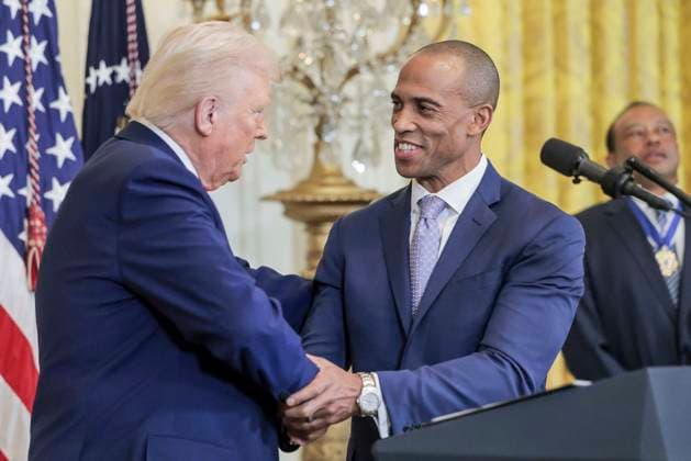 US President Donald J. Trump (L) with White House Opportunity and Revitalization Council Executive Director Scott Turner (R) during a reception honoring Black History Month in the East Room of the White House in Washington, DC, on February 20, 2025.  WAX20250220863 SHAWNxTHEW