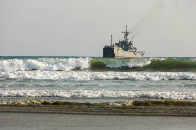 February 23, 2025, Konarak, Sistan And Baluchestan, Iran: The amphibious operation, along with beaching and coastal defense activities, conduct by Navy rangers with the assistance of a Navy frigate and the armored units of the Islamic Republic of Iran Army s Ground Forces in the third maritime zone of Konarak in the Persian Gulf. An amphibious operation refers to a coordinated attack from the sea, performed by naval and land forces deploying from ships, aimed at striking the enemy s shoreline and culminating in troops landing on those shores. Konarak Iran - ZUMAi98_ 20250223_zih_i98_082 Copyright: xIranianxArmyxOfficex