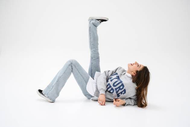 Creative Highlights Symbolfotos Playful woman lying on against white background model released, Symbolfoto property released, EYAF03313