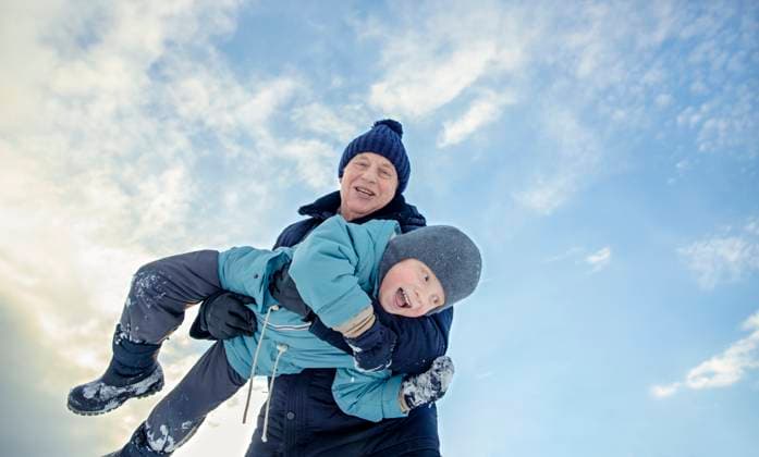Creative Highlights Symbolfotos Happy grandfather holding grandson in arms under cloudy sky model released, Symbolfoto, MBLF00748