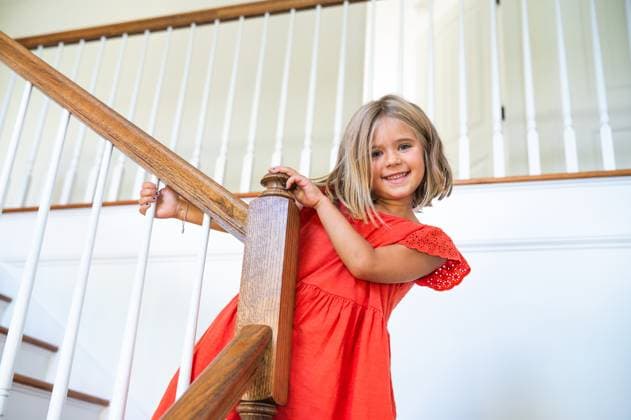 Creative Highlights Symbolfotos Young Blonde Girl in Dress Walking Down the Stairs and Smiling Waynesboro, Virginia, United States CR_AVYA250223A-1612160-01 ,model released, Symbolfoto ,property released