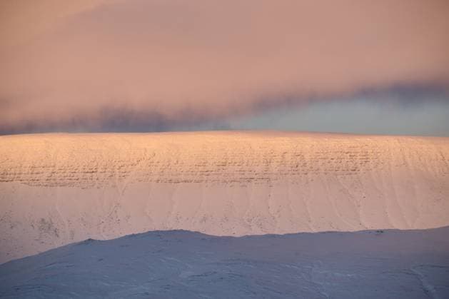 Creative Highlights World Pastel pink and blue sunrise illuminating snowy mountain ridges Reykjavík, Reykjavíkurborg, Iceland R_OSBJ250223-1656772-01