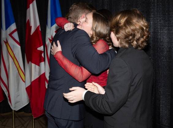 February 25, 2025, St. John s, Nl, CANADA: Premier Andrew Furey embraces his daughter Rachel as son Mark looks on following a news conference in St.John s, Tuesday, Feb.25, where he announced his resignation as premier of Newfoundland and Labrador. St. John s CANADA  - ZUMAc35_ 20250225_zaf_c35_033 Copyright: xPaulxDalyx